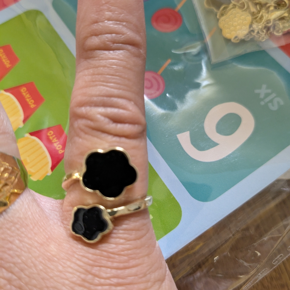 Stylish Gold Ring with Black Floral Design